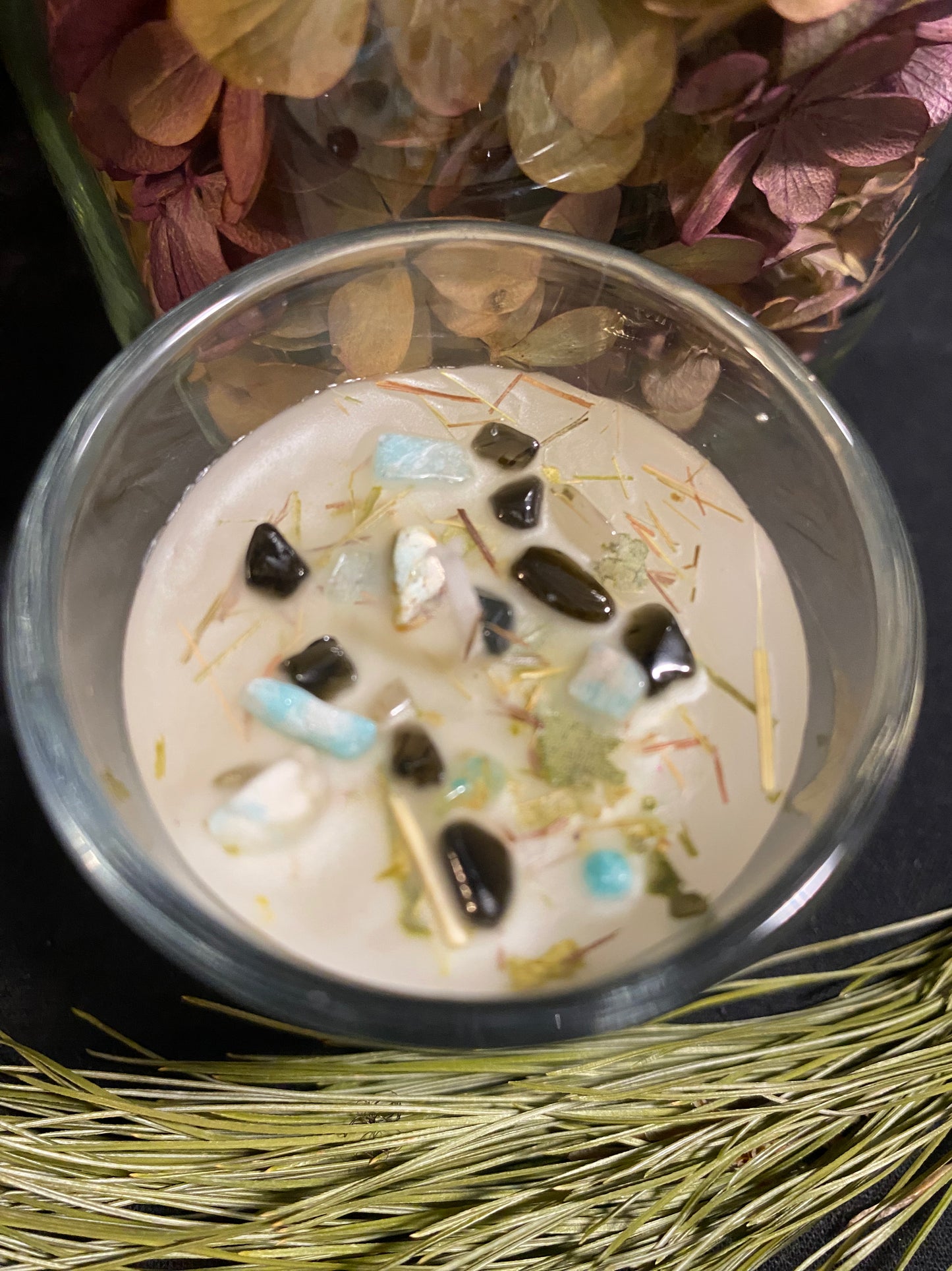 Safety and Protection Candle. Adorned with Obsidian and Aquamarine Crystals. Dressed with lemon oil and herbs.